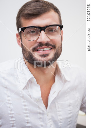 Casual businessman smiling at camera Casual businessman smiling at camera 12105968
