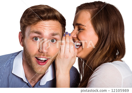 woman whispering secret into friends ear woman whispering secret into friends ear 12105989