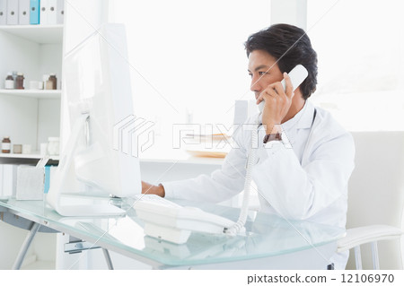 Doctor making work phone calls Doctor making work phone calls 12106970