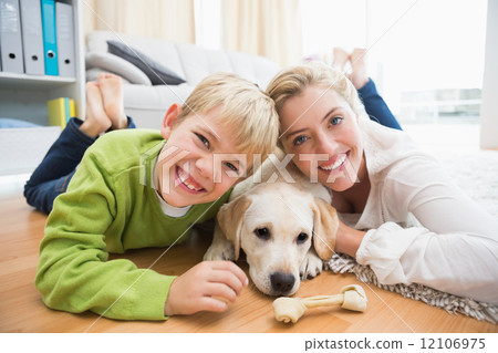Happy mother and son with puppy Happy mother and son with puppy 12106975