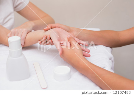 Woman getting a hand massage Woman getting a hand massage 12107493