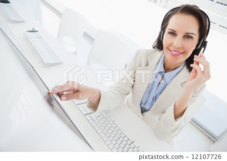 Smiling businesswoman looking at camera 12107726