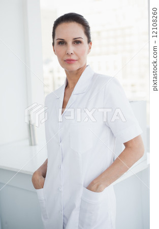 Smiling doctor looking at camera Smiling doctor looking at camera 12108260