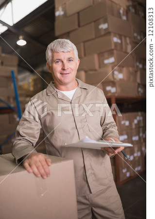 Warehouse worker using digital tablet Warehouse worker using digital tablet 12108313