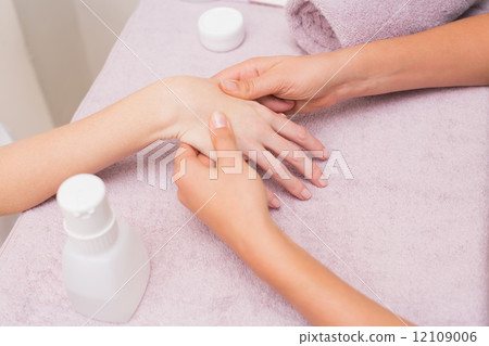 Woman getting a hand massage 12109006