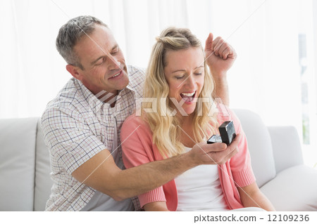 Man offering a romantic gift to his girlfriend 12109236