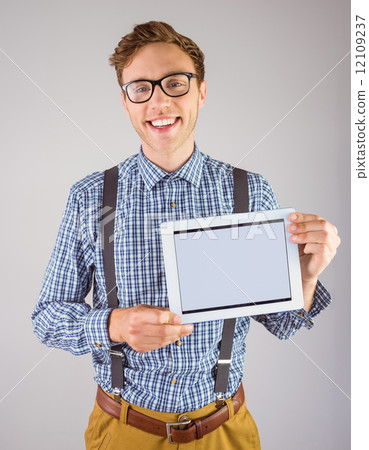 Geeky businessman showing his tablet pc 12109237