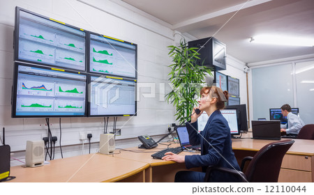 Technician sitting in office running diagnostics 12110044