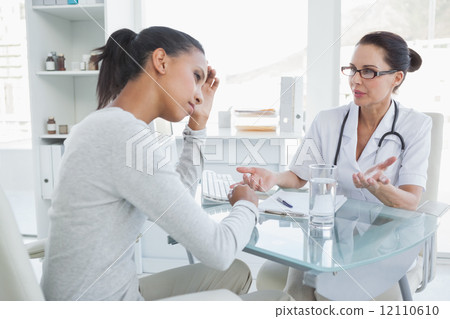 Doctor talking with upset looking patient Doctor talking with upset looking patient 12110610