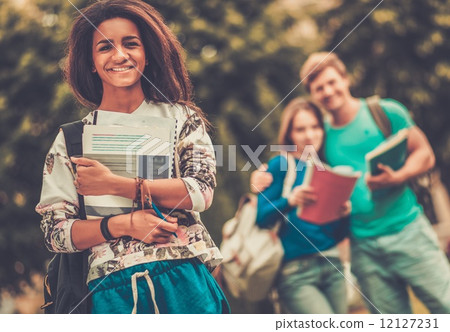 African-american girl student in a city park on summer day African-american girl student in a city park on summer day 12127231
