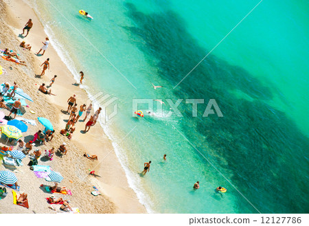 people relaxing on the public beach people relaxing on the public beach 12127786