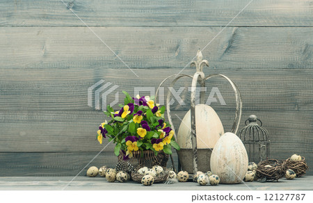easter decoration with eggs and pansy flowers 12127787