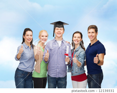 group of students with diploma showing thumbs up group of students with diploma showing thumbs up 12139331