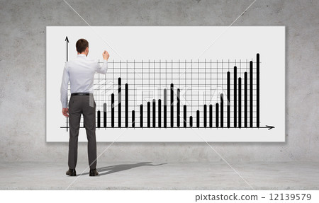 businessman or teacher with marker from back 12139579