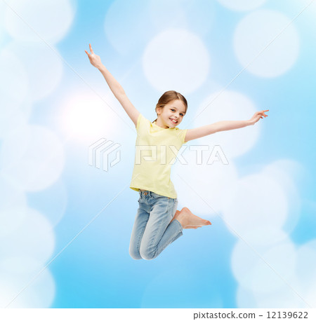 smiling little girl jumping 12139622