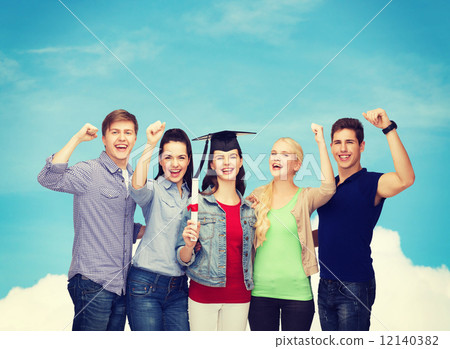group of standing smiling students with diploma 12140382