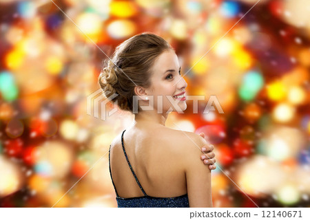 smiling woman in evening dress 12140671
