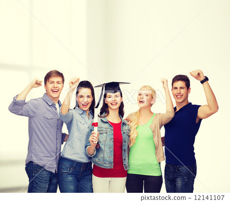 group of standing smiling students with diploma 12141107