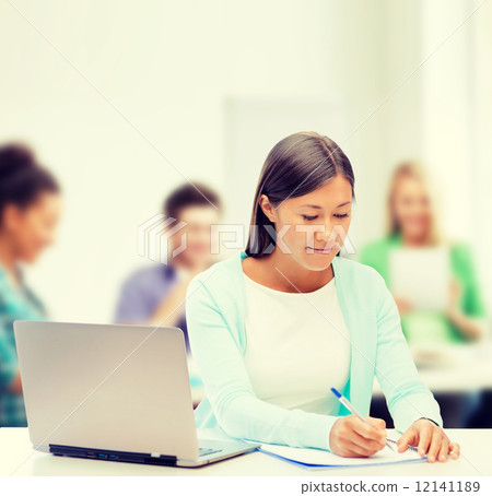 asian businesswoman with laptop and documents 12141189