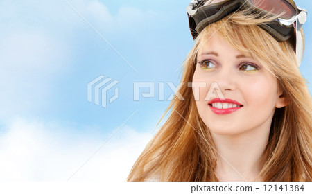 smiling teenage girl in snowboard goggles 12141384