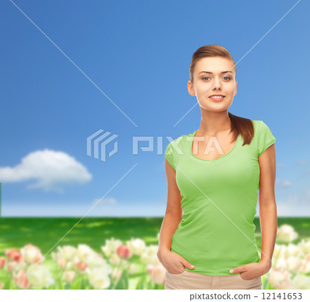 smiling young woman in blank green t-shirt 12141653