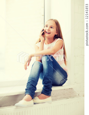 girl with smartphone at school 12141853