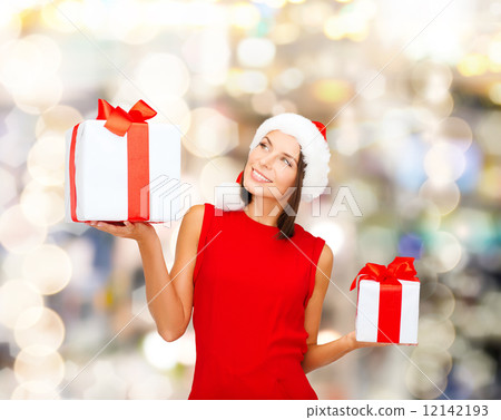 smiling woman in red dress with gift box 12142193
