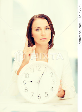 attractive businesswoman with white clock 12142259