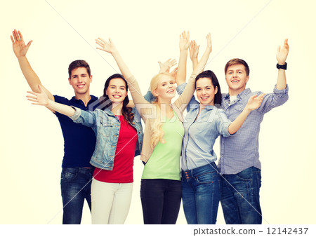 group of smiling students waving hands 12142437