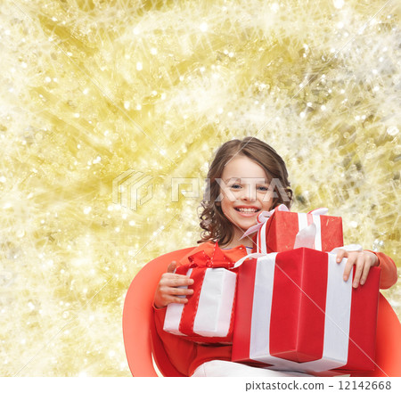 smiling little girl with gift boxes smiling little girl with gift boxes 12142668