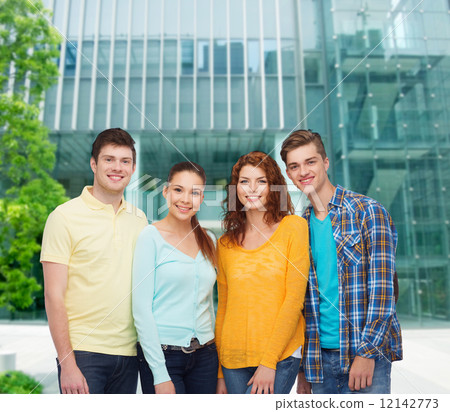 group of smiling teenagers over city background 12142773
