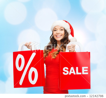 woman in red dress with shopping bags 12142786