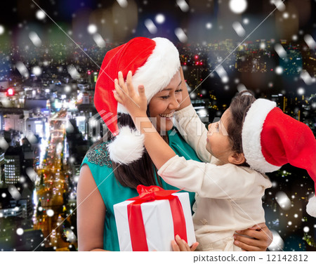 happy mother and child girl with gift box 12142812
