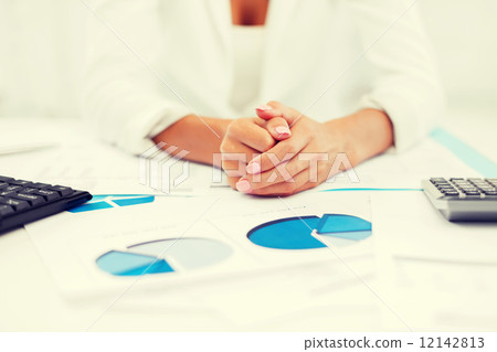 woman hands with charts and papers 12142813