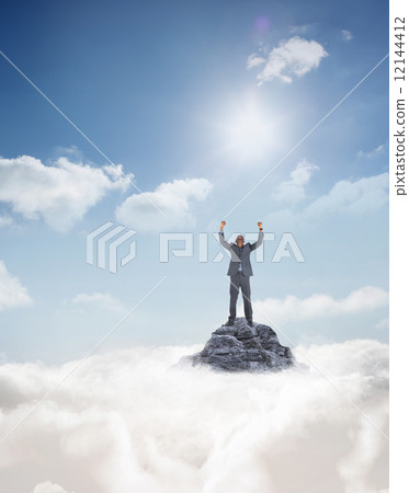 Composite image of happy businessman cheering 12144412