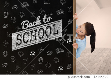 Composite image of businesswoman looking around the corner 12145329