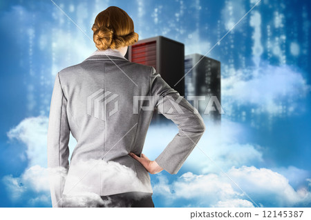 Composite image of redhead businesswoman with hand on hip Composite image of redhead businesswoman with hand on hip 12145387