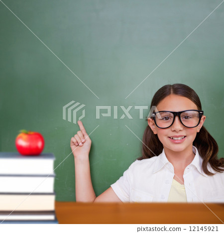 Composite image of cute pupil pointing 12145921