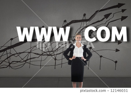 Composite image of businesswoman standing with hands on hips 12146031