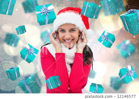 Composite image of festive brunette 12146577