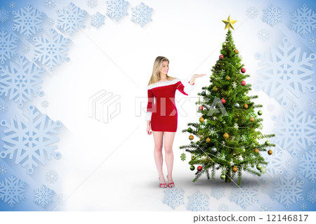 Composite image of pretty girl presenting in santa outfit 12146817