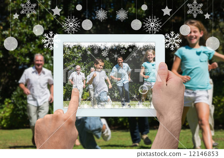 Composite image of hands holding tablet pc Composite image of hands holding tablet pc 12146853
