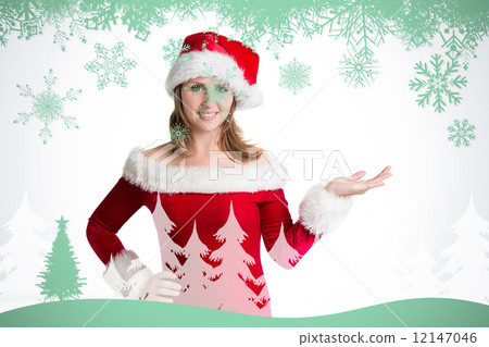 Composite image of pretty woman in santa costume presenting your Composite image of pretty woman in santa costume presenting your 12147046