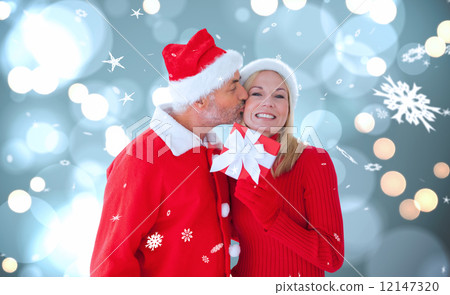 Composite image of festive couple 12147320