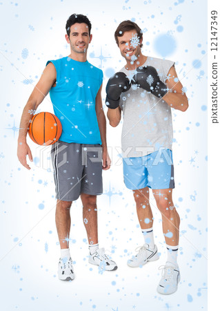 Composite image of two fit men with boxing gloves and basketball Composite image of two fit men with boxing gloves and basketball 12147349