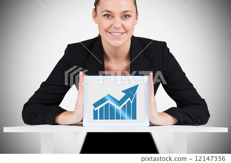 Composite image of businesswoman showing tablet pc Composite image of businesswoman showing tablet pc 12147356
