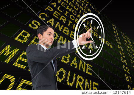 Composite image of serious asian businessman pointing 12147614