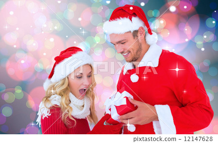 Composite image of young festive couple 12147628