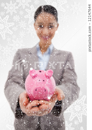 Composite image of portrait of a happy businesswoman showing a p 12147644