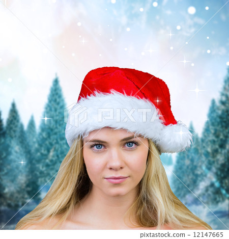 Composite image of blonde with bare shoulders in santa hat Composite image of blonde with bare shoulders in santa hat 12147665